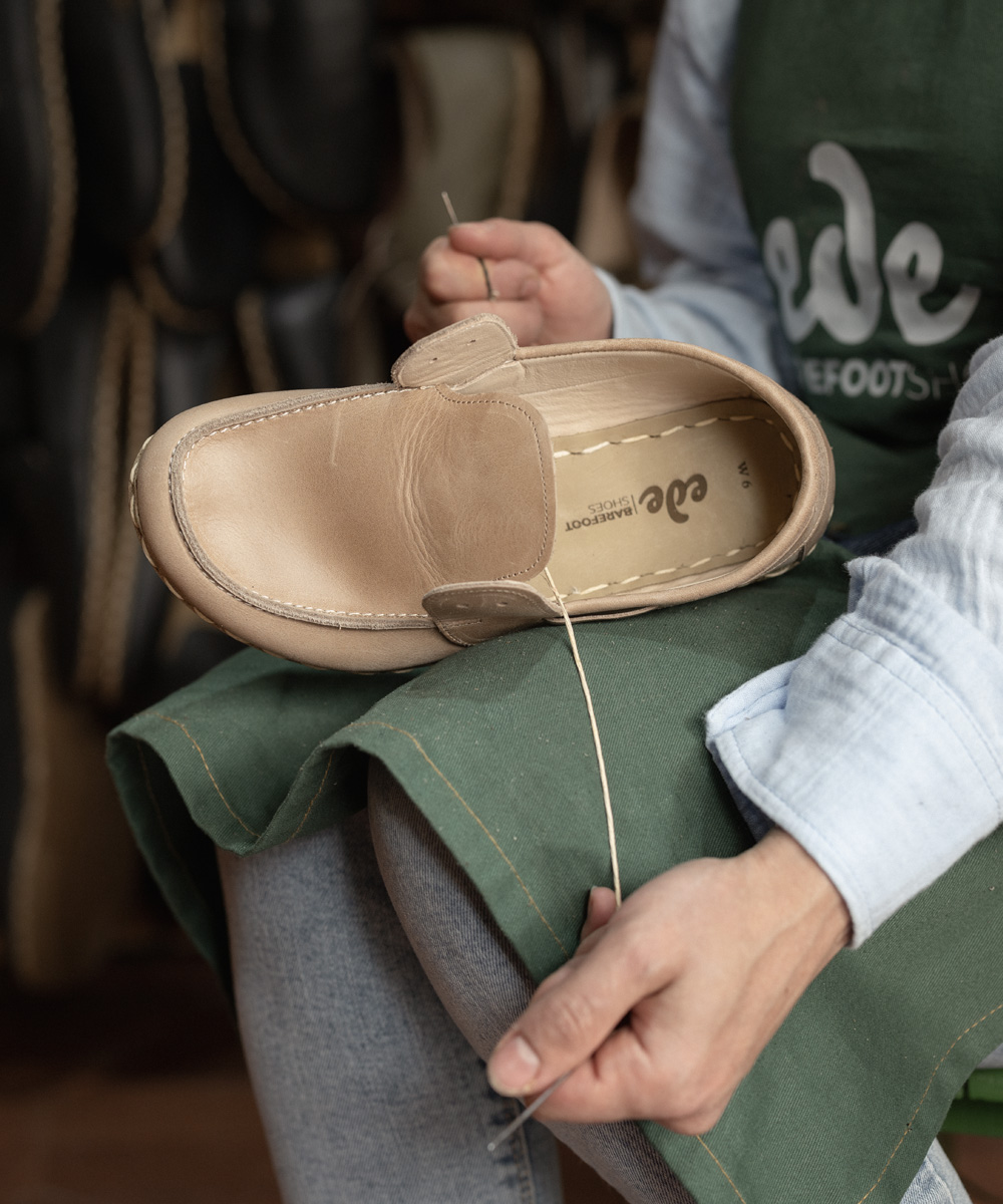 Hand-stitching the sole of a barefoot loafer at Ede