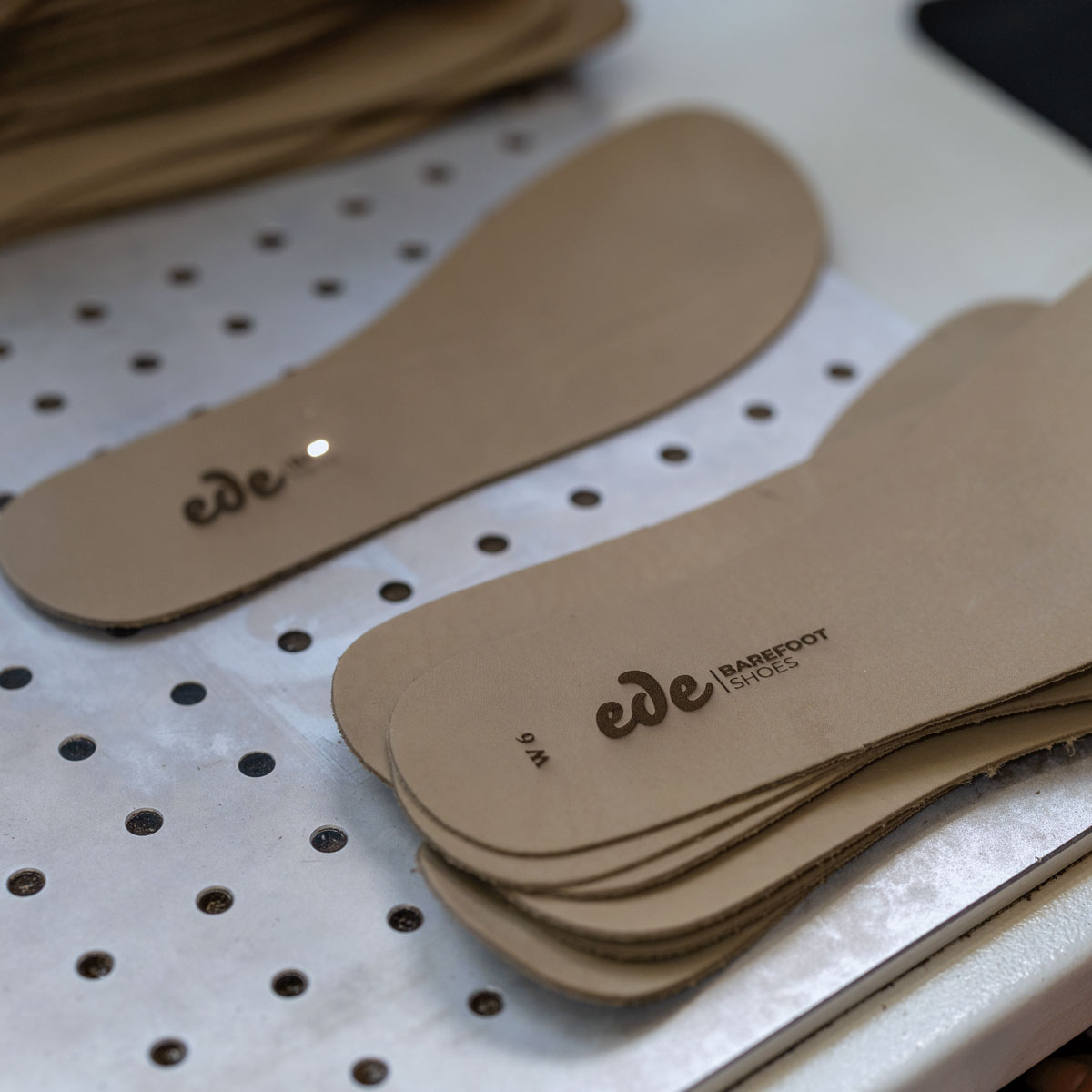 Laser-engraved logo on insole